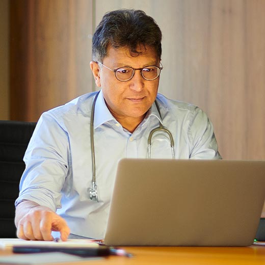 Photo of healthcare professional at computer