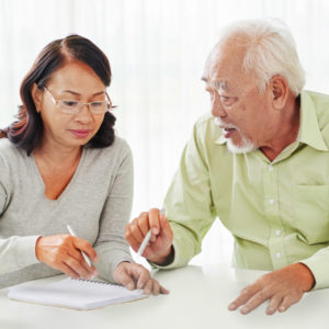 Photo of couple going over documents