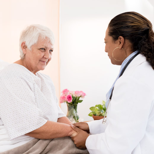 Senior woman talking with physician