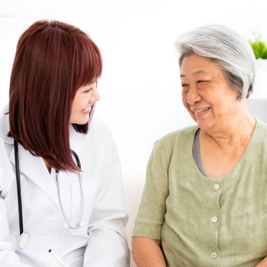 Photo of physician talking with senior patient