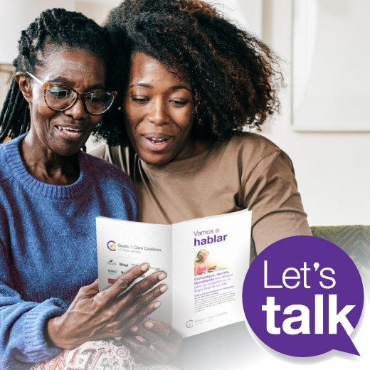 Photo of senior woman and daughter flipping over a Spanish version of the Let's Talk booklet